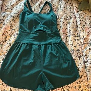 Green exercise/workout romper with cutout in the front. Pocket in the back!